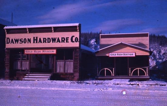 Colour view of the Dawson Hardware Store which also served as a Gold Rush Museum. A smaller building adjacent served as the gift store, called the Gold Rush Boutique. The buildings and museum were owned by Joe and Marion Langevin.
