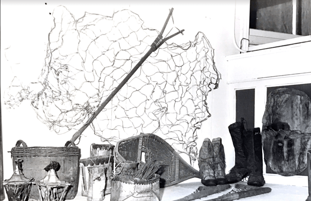 An exhibit containing a net, boots and other material